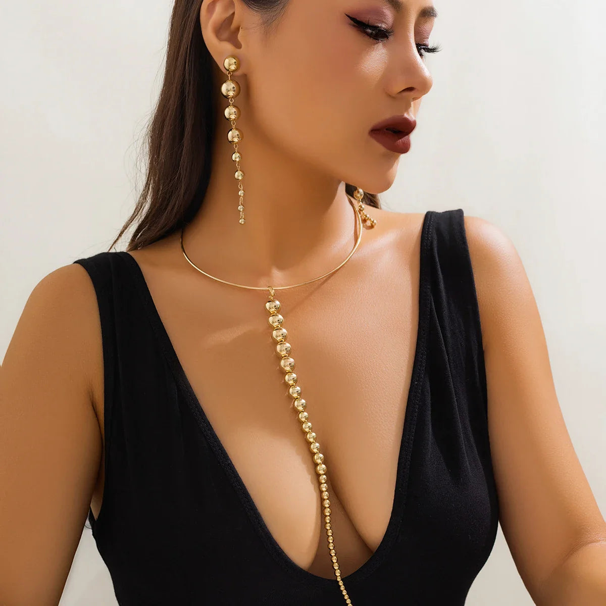 Conjunto Colar e Brincos Longos de bolas Douradas Argentia