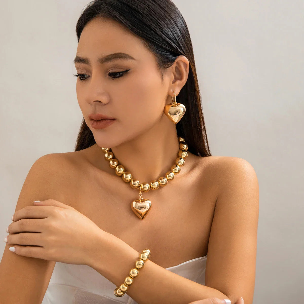 Conjunto Colar Brincos e Pulseira Coração Dourado Argentia